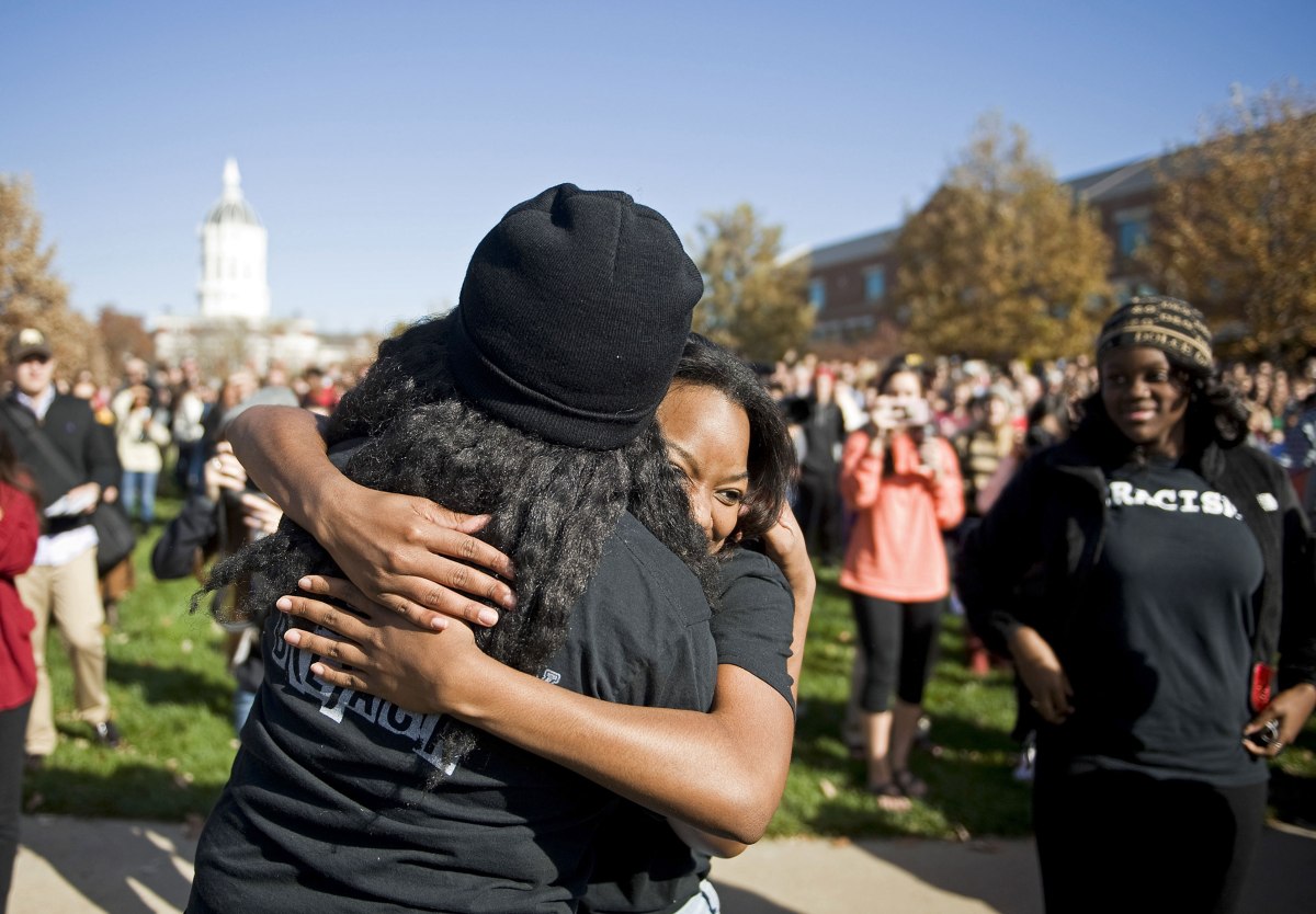 Protesters at the University of Missouri react to the Nov. 9 resignation of system president Tim Wolfe, which was spurred by Black Lives Matter demonstrations