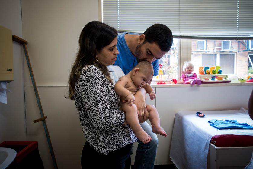 Isabel and Moises Albuquerque and their son son at the Associacao de Assistencia a Crianca Deficiente, a rehabilitation center for disabled children, in Recife, Brazil, Feb. 1, 2016.
