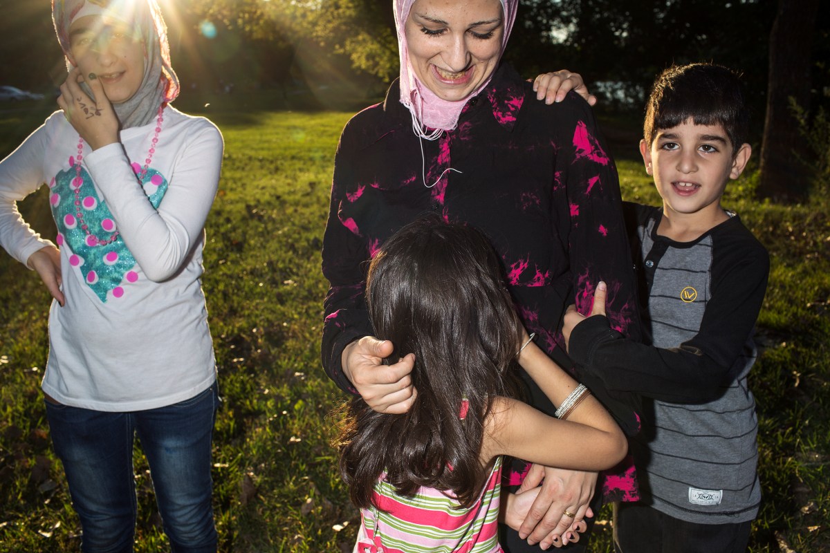 Ghazweh plays with Sedra, Hala and Mutaz at a park in Des Moines.