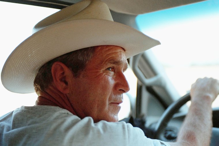 With Barney on his lap, President George W. Bush takes Secretary of Housing and Urban Development Mel Martinez and his wife, Kitty, on a driving tour of Prairie Chapel Ranch Wednesday, Aug. 7, 2001, in Crawford, Texas. Photo by Eric Draper, Courtesy of the George W. Bush Presidential Library and Museum