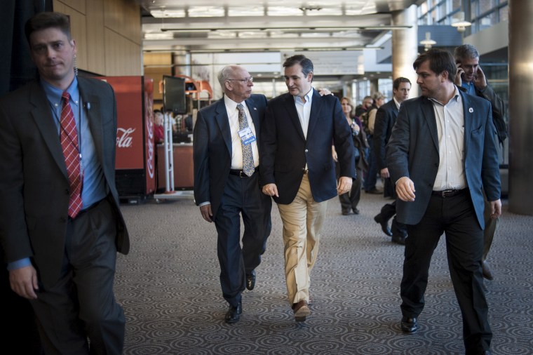Ted Cruz speaks with his father Rafael Cruz at the Freedom 2015 National Religious Liberties Conference, on Nov. 6, 2015, in Des Moines, Iowa.