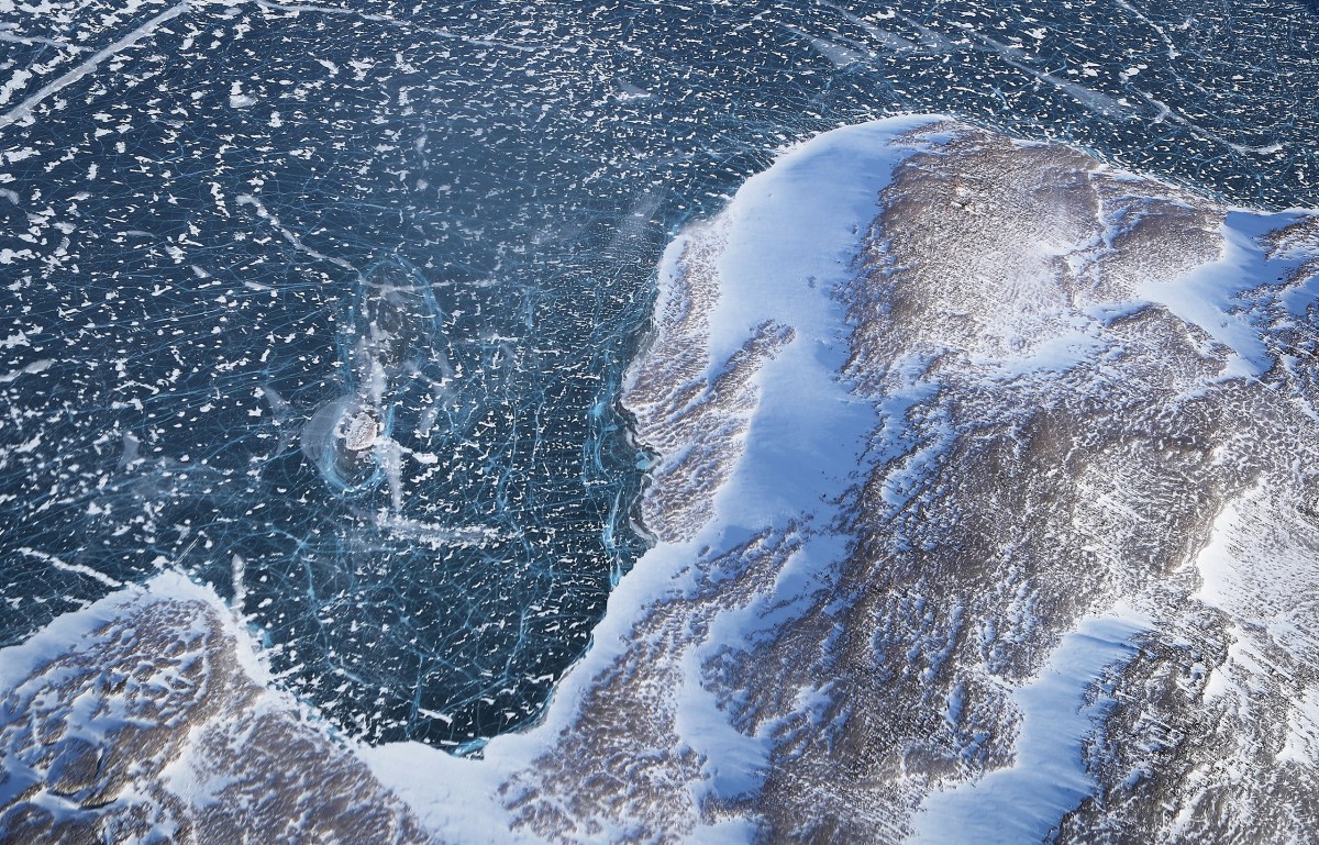 Sea ice meets land along the Upper Baffin Bay coast above Greenland on March 27, 2017.