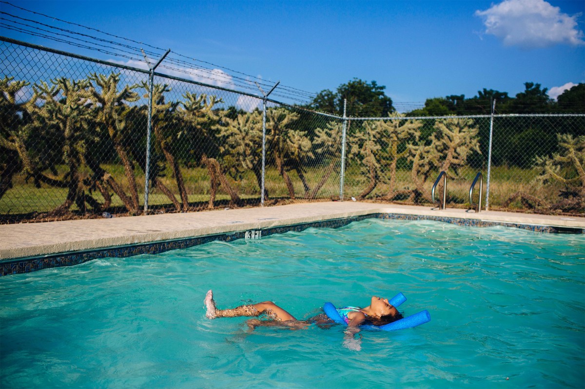 Layla plays in the community pool near her grandmother's home. Sara Naomi Lewkowicz for TIME