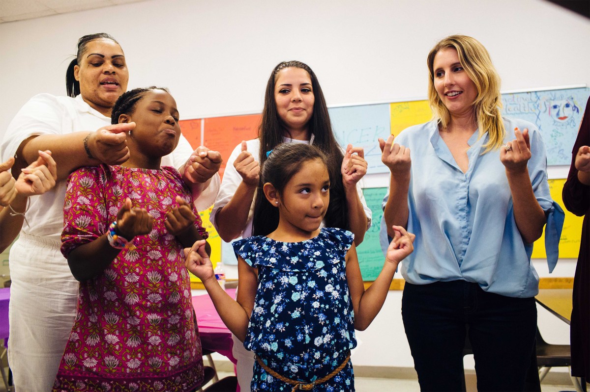 Magan tells the troop that Layla has a new baby guinea pig named Penelope during a circle-up before lunch. Sara Naomi Lewkowicz for TIME