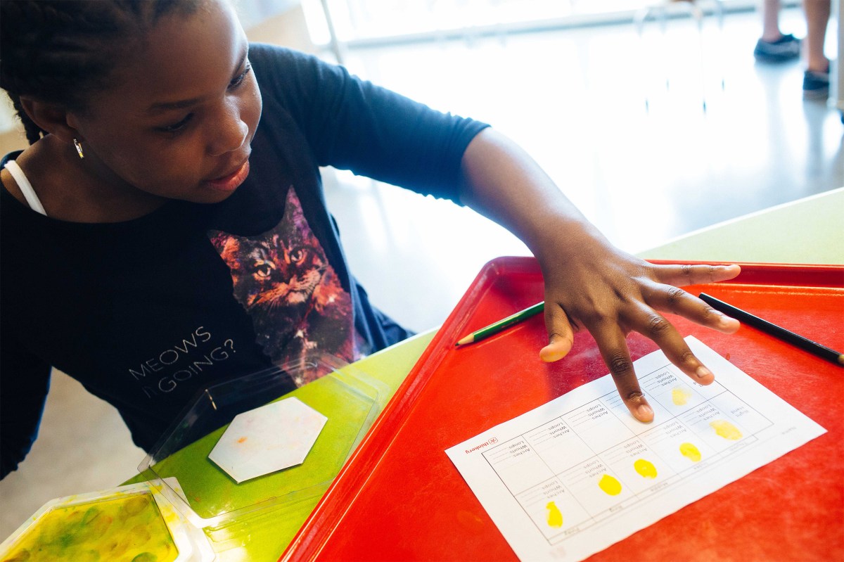 Trunarah Miller, 8, spends an afternoon at The Thinkery in Austin with her Girl Scouts mentor. Sara Naomi Lewkowicz for TIME
