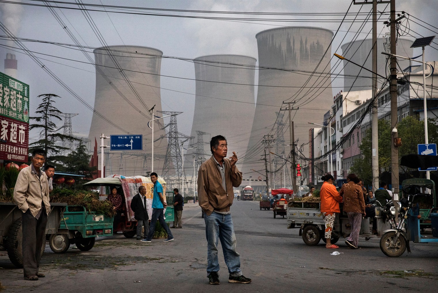 Chinese street vendors and customers gather at a local market.