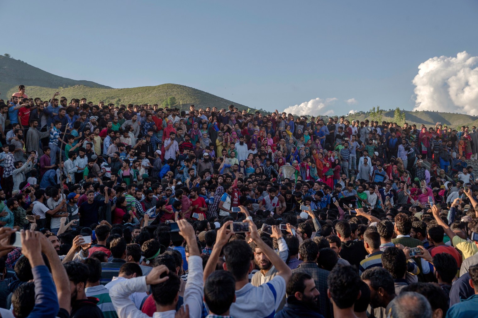 Villagers shout slogans as they wait for the body of Bashir Lashkari, a local rebel commander killed in a gun battle, in his native village of Souf, about 75 Kilometers south of Srinagar on July 1, 2017. A woman and a young man were killed and several other people injured during anti-India protests and clashes in Indian-controlled Kashmir on Saturday following a counterinsurgency operation by government forces that killed two rebels in the disputed region, police said.