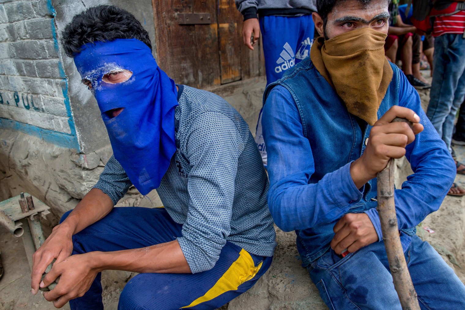 Kashmiri villagers take a break during a protest after the funeral procession of Akeel Ahmed Bhat, a teenage boy in Haal village, about 30 miles (47 km.) south of Srinagar, on Aug. 2, 2017.