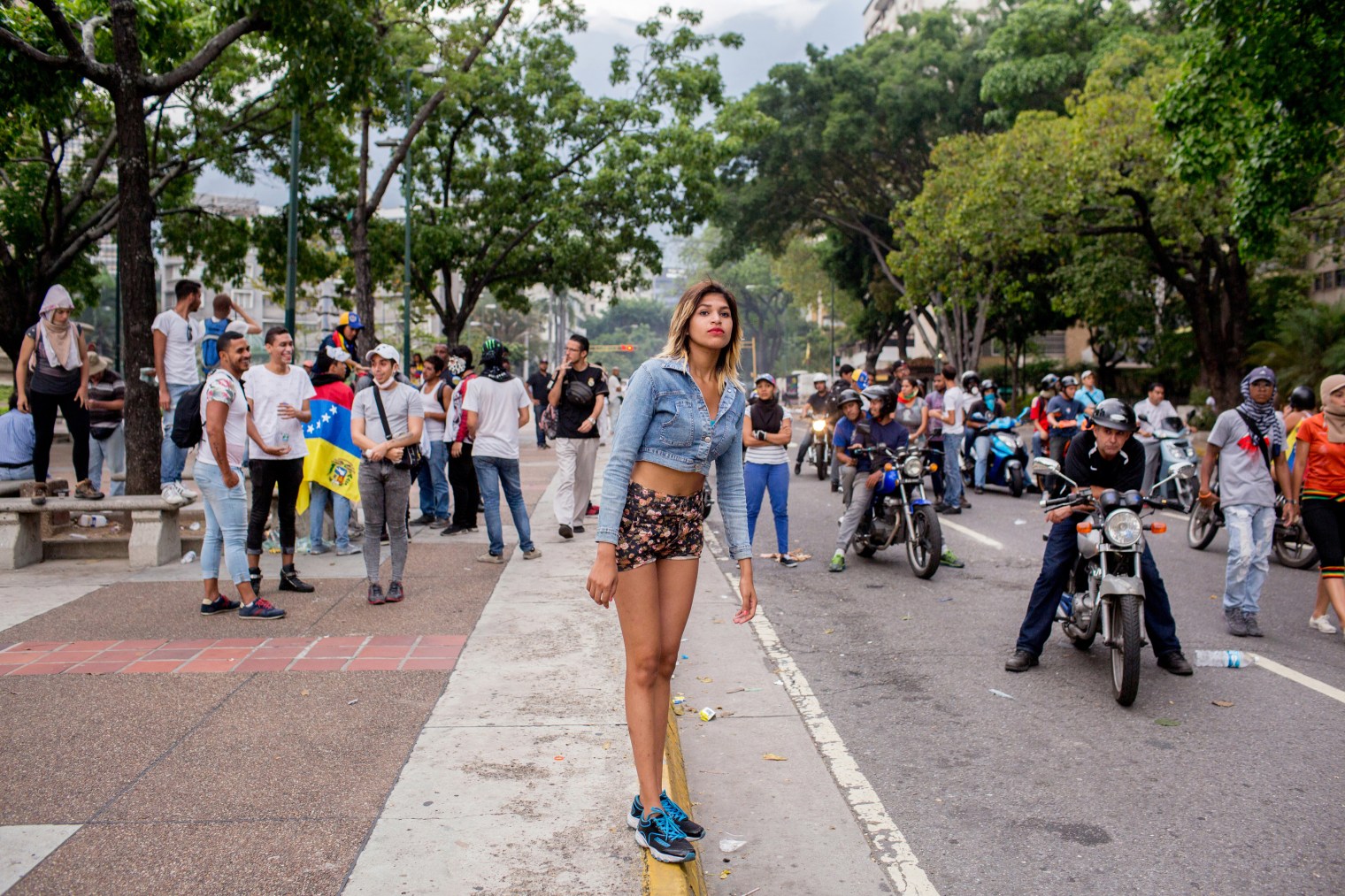 A woman stands on the median during a protest in Altamira, eastern Caracas, on April 19 2017.